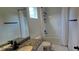Bathroom with granite countertop, white tile and shower/tub combo at 18410 Blue Heron Cir, Deer Island, FL 32778