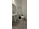 Powder bathroom with pedestal sink, black fixtures and modern design at 18410 Blue Heron Cir, Deer Island, FL 32778