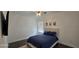 Bedroom with a bed, ceiling fan, and dark wood-like floors at 18410 Blue Heron Cir, Deer Island, FL 32778