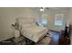Bright bedroom with a large comfortable bed and modern decor at 18410 Blue Heron Cir, Deer Island, FL 32778