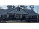 Charming Deer Island Golf clubhouse with golf carts parked nearby at 18410 Blue Heron Cir, Deer Island, FL 32778
