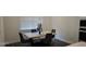 Elegant dining area with a marble table, modern chairs, and natural light from a nearby window at 18410 Blue Heron Cir, Deer Island, FL 32778