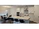 Open-concept kitchen with stainless steel appliances, center island, and adjacent dining area at 18410 Blue Heron Cir, Deer Island, FL 32778