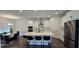 Open-concept kitchen with stainless steel appliances, center island, and adjacent dining area at 18410 Blue Heron Cir, Deer Island, FL 32778