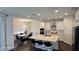 Open-concept kitchen with stainless steel appliances, center island, and adjacent dining area at 18410 Blue Heron Cir, Deer Island, FL 32778