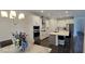 Open-concept kitchen with stainless steel appliances, center island, and adjacent dining area at 18410 Blue Heron Cir, Deer Island, FL 32778