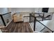 Stylish living room featuring a sectional sofa, modern rug, and black metal railing at 18410 Blue Heron Cir, Deer Island, FL 32778
