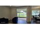 Open living area with screened in porch offering golf course views at 18410 Blue Heron Cir, Deer Island, FL 32778