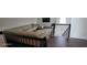 Open loft area featuring a sectional sofa, television, and view of the staircase at 18410 Blue Heron Cir, Deer Island, FL 32778