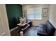 Home office setup with a modern desk, comfortable seating, and natural light at 18410 Blue Heron Cir, Deer Island, FL 32778