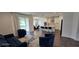 Living/Dining area of the home with access to the kitchen, with a large open floor plan at 18410 Blue Heron Cir, Deer Island, FL 32778