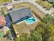 A bird's eye view captures this home's fenced backyard with an in-ground pool and neighborhood street at 2169 Webster Ct, Deltona, FL 32738