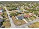 An aerial view of the property, showcasing its location within a neighborhood with mature trees and well-kept landscaping at 2169 Webster Ct, Deltona, FL 32738