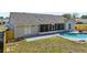 A sunny backyard view features a screened lanai with a patio, and a pool, perfect for outdoor enjoyment at 2169 Webster Ct, Deltona, FL 32738