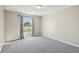 Bedroom with a large window and carpet floors at 2169 Webster Ct, Deltona, FL 32738