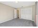 Bedroom features include grey carpet and a closet with white bi-fold doors at 2169 Webster Ct, Deltona, FL 32738