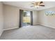 Bright bedroom with ceiling fan and a sliding glass door to the backyard at 2169 Webster Ct, Deltona, FL 32738