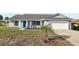 Charming single-story home with gray exterior, well-maintained lawn, and attached garage, offers curb appeal at 2169 Webster Ct, Deltona, FL 32738