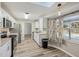 Modern kitchen featuring white cabinetry, stainless appliances and adjacent window with a pool view at 2169 Webster Ct, Deltona, FL 32738