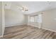 Spacious room showcasing natural light from a large window, complemented by hardwood flooring and neutral colors at 2169 Webster Ct, Deltona, FL 32738