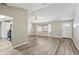 Open-concept living area featuring hard floors, neutral walls, and seamlessly integrates the kitchen space at 2169 Webster Ct, Deltona, FL 32738