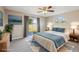 Inviting bedroom with a king bed, calming colors, and a sliding glass door to the backyard, virtually staged at 2169 Webster Ct, Deltona, FL 32738