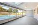 Bright sunroom with views of the pool and backyard at 2169 Webster Ct, Deltona, FL 32738