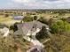 Beautiful aerial view of a property with a large driveway and scenic surroundings at 2207 Cairns Ct, Orlando, FL 32835