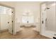 Bright bathroom featuring a free-standing tub, glass block window, and walk-in shower at 2207 Cairns Ct, Orlando, FL 32835