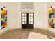 Elegant entryway with high ceilings, modern lighting, and contemporary artwork at 2207 Cairns Ct, Orlando, FL 32835
