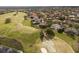 Aerial view of golf course community showcasing backyard pools, mature trees, and a scenic fairway at 2207 Cairns Ct, Orlando, FL 32835