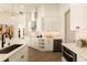 Well-appointed kitchen with sleek white cabinetry, quartz countertops, and stainless steel appliances at 2207 Cairns Ct, Orlando, FL 32835