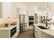 Modern kitchen with stainless steel appliances and an eat-in kitchen island at 2207 Cairns Ct, Orlando, FL 32835