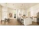 Spacious open-concept living space with modern kitchen, dining area, and sitting area at 2207 Cairns Ct, Orlando, FL 32835