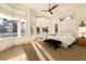 Bright main bedroom with lots of windows and a view to the outside balcony at 2207 Cairns Ct, Orlando, FL 32835