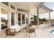 An outdoor living space with neutral furnishings and lots of natural light from nearby doors and windows at 2207 Cairns Ct, Orlando, FL 32835
