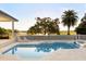 Beautiful in-ground pool with an adjacent spa, all overlooking a lush golf course at 2207 Cairns Ct, Orlando, FL 32835