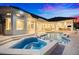 Stunning exterior view of backyard oasis with pool and spa at dusk at 2207 Cairns Ct, Orlando, FL 32835