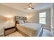 Cozy bedroom featuring neutral tones, natural lighting and a stylish wooden headboard at 224 E Kelly Park Rd, Apopka, FL 32712