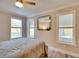 Inviting bedroom with natural light, a large window and a stylish ceiling fan at 224 E Kelly Park Rd, Apopka, FL 32712