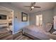 Bedroom with wood-look floors and a view into the living room and adjacent bathroom at 224 E Kelly Park Rd, Apopka, FL 32712