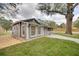 Beautiful single-story home with charming gray siding, manicured lawn, and a peaceful outdoor setting at 224 E Kelly Park Rd, Apopka, FL 32712