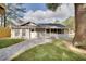 Well-kept single story home with a new walkway, screened porch and gray paint at 224 E Kelly Park Rd, Apopka, FL 32712