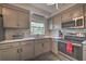Bright kitchen with updated cabinets, stainless steel appliances, and plenty of counter space at 224 E Kelly Park Rd, Apopka, FL 32712
