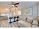 Comfortable living room with breakfast bar featuring modern pendant lighting and adjacent kitchen at 224 E Kelly Park Rd, Apopka, FL 32712