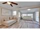 Cozy living room with comfortable seating and bright sunroom, creating a warm and inviting space at 224 E Kelly Park Rd, Apopka, FL 32712