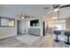 Inviting living room flows into the kitchen, complete with breakfast bar and modern appliances at 224 E Kelly Park Rd, Apopka, FL 32712