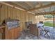 Outdoor patio with a grill and seating area, perfect for outdoor dining and entertaining at 224 E Kelly Park Rd, Apopka, FL 32712
