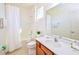 Clean bathroom with a tub shower, modern vanity, and ample counter space at 2555 Shanti Dr, Kissimmee, FL 34746