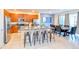 Open kitchen and dining area with granite countertops and stainless steel appliances at 2555 Shanti Dr, Kissimmee, FL 34746